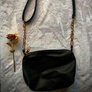 Shoulder or crossbody black and gold purse